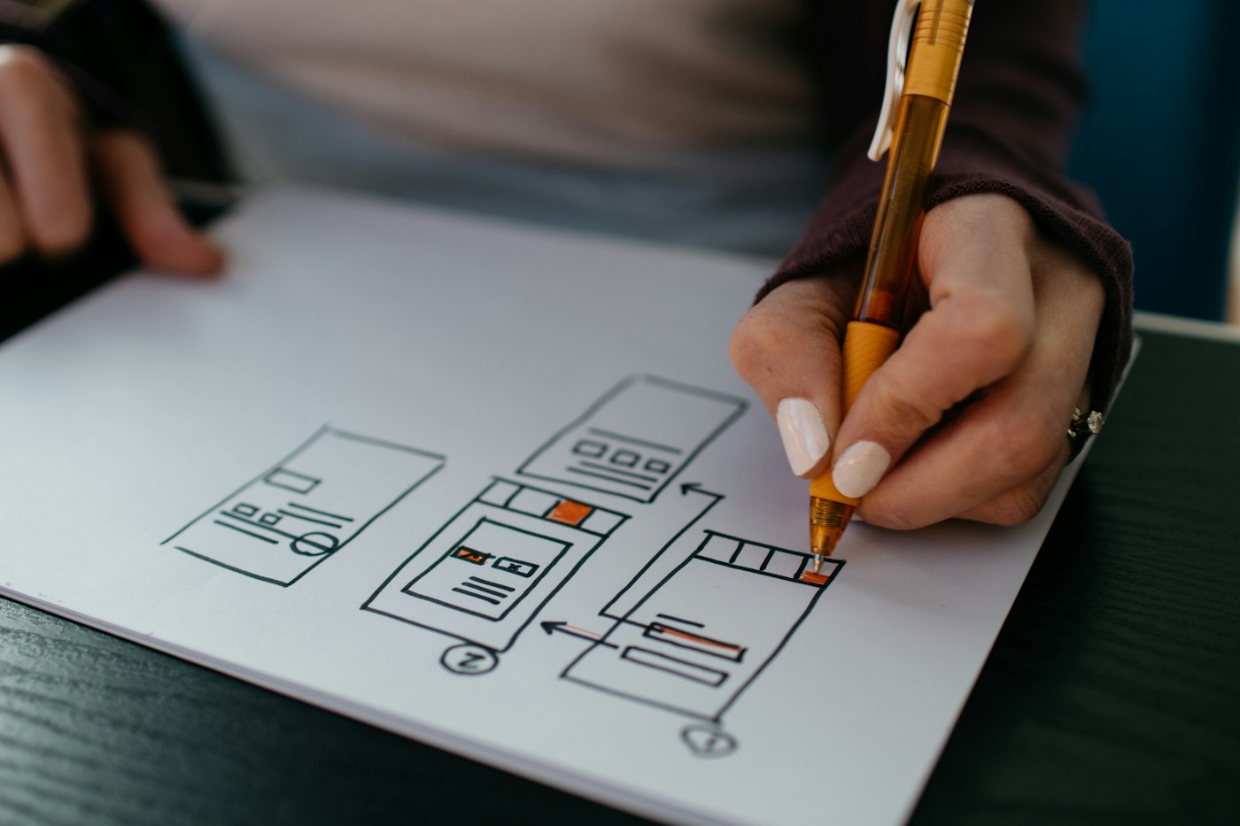 Hand sketching app wireframes for a prototype